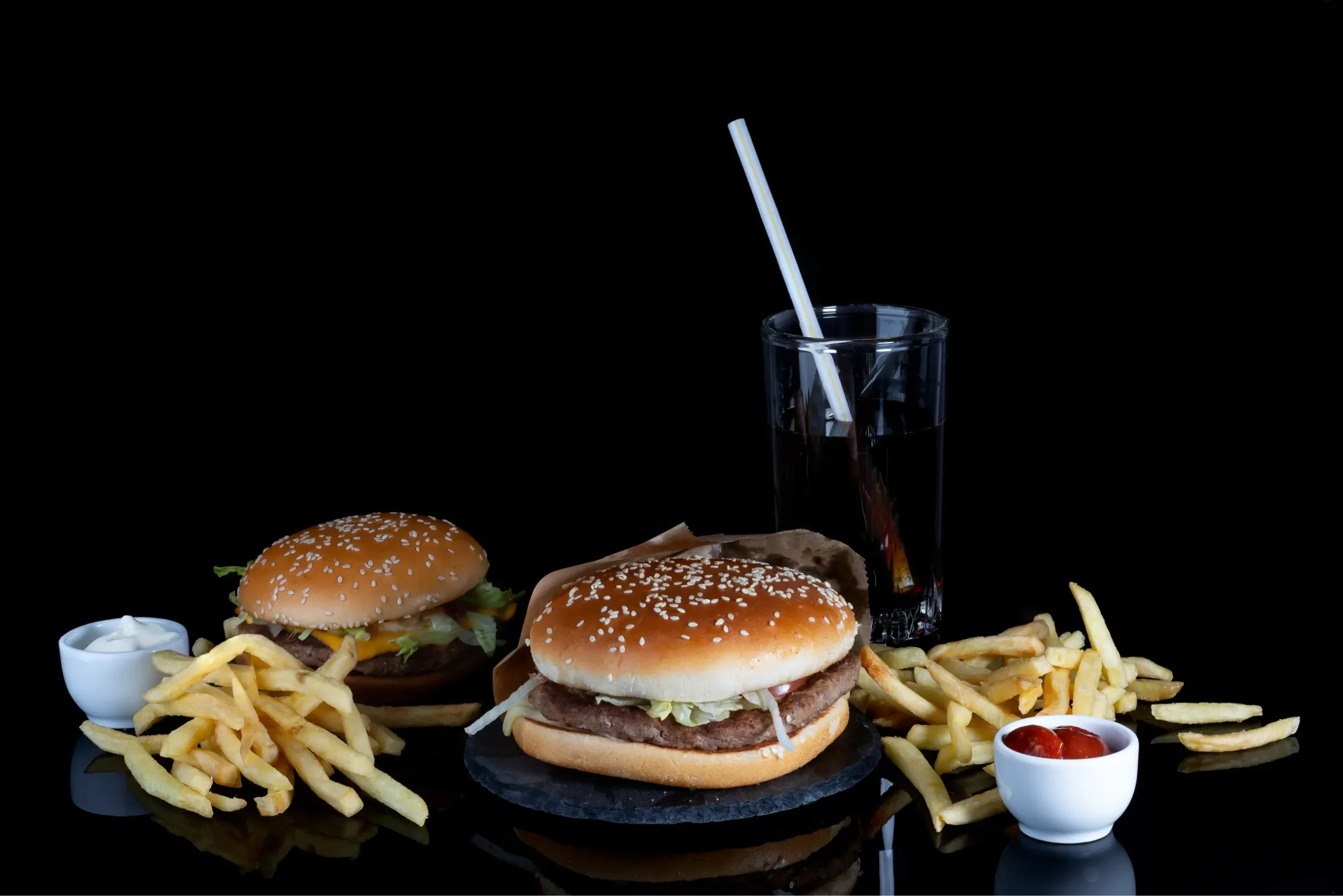 Burger And French Fries On Black Glass With Reflec 2024 12 05 18 11 09 Utc